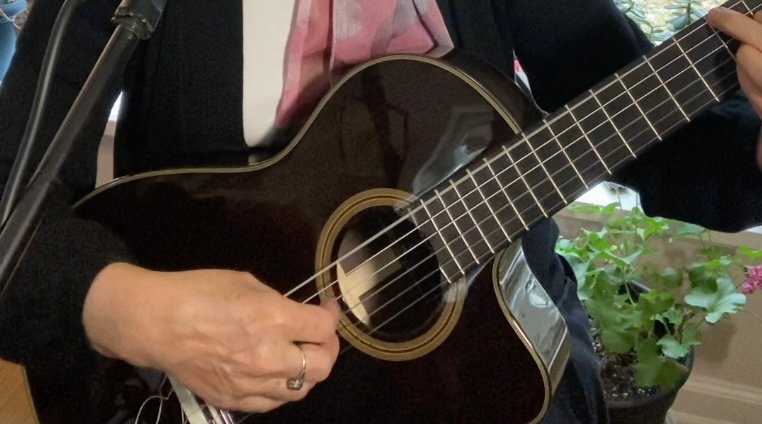Martha S. Bache-Wiig playing guitar